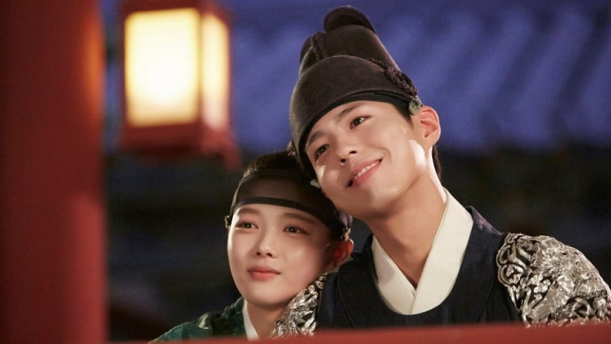 Park Bo-gum smiling in traditional royal attire as Crown Prince Lee Yeong in the historical K-drama Love in the Moonlight.